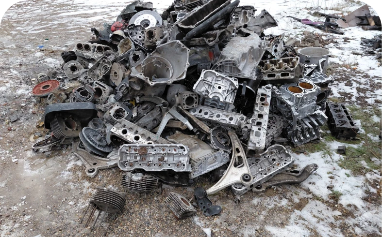 Scrap metal heap with engine components.