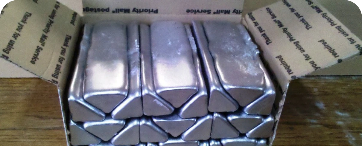 Triangular silver ingots stacked neatly