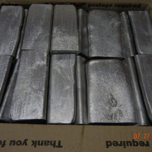 Metal ingots stacked in a box